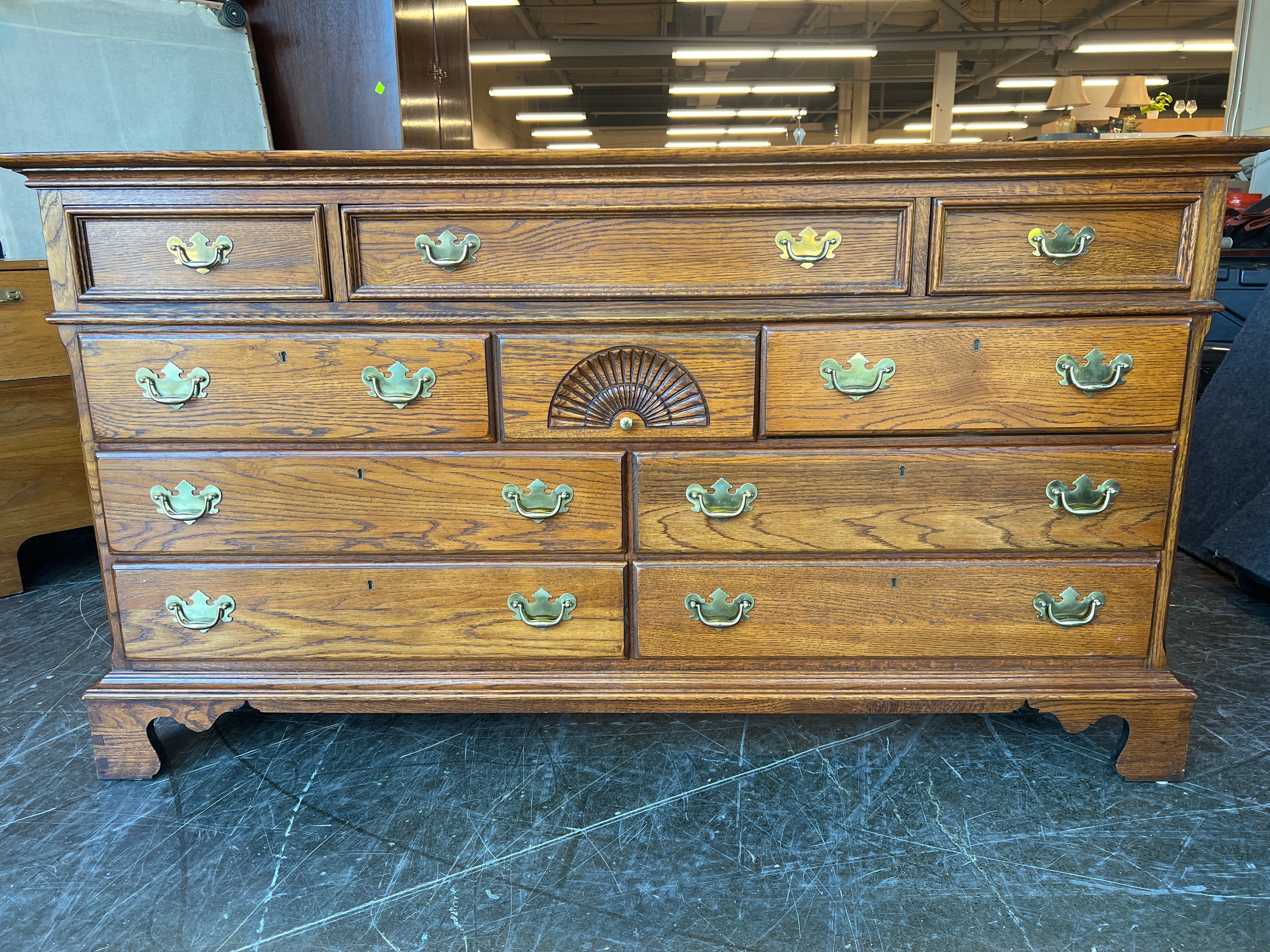 Richly-Toned Wood Dresser with Carved Center Drawer - Image 3