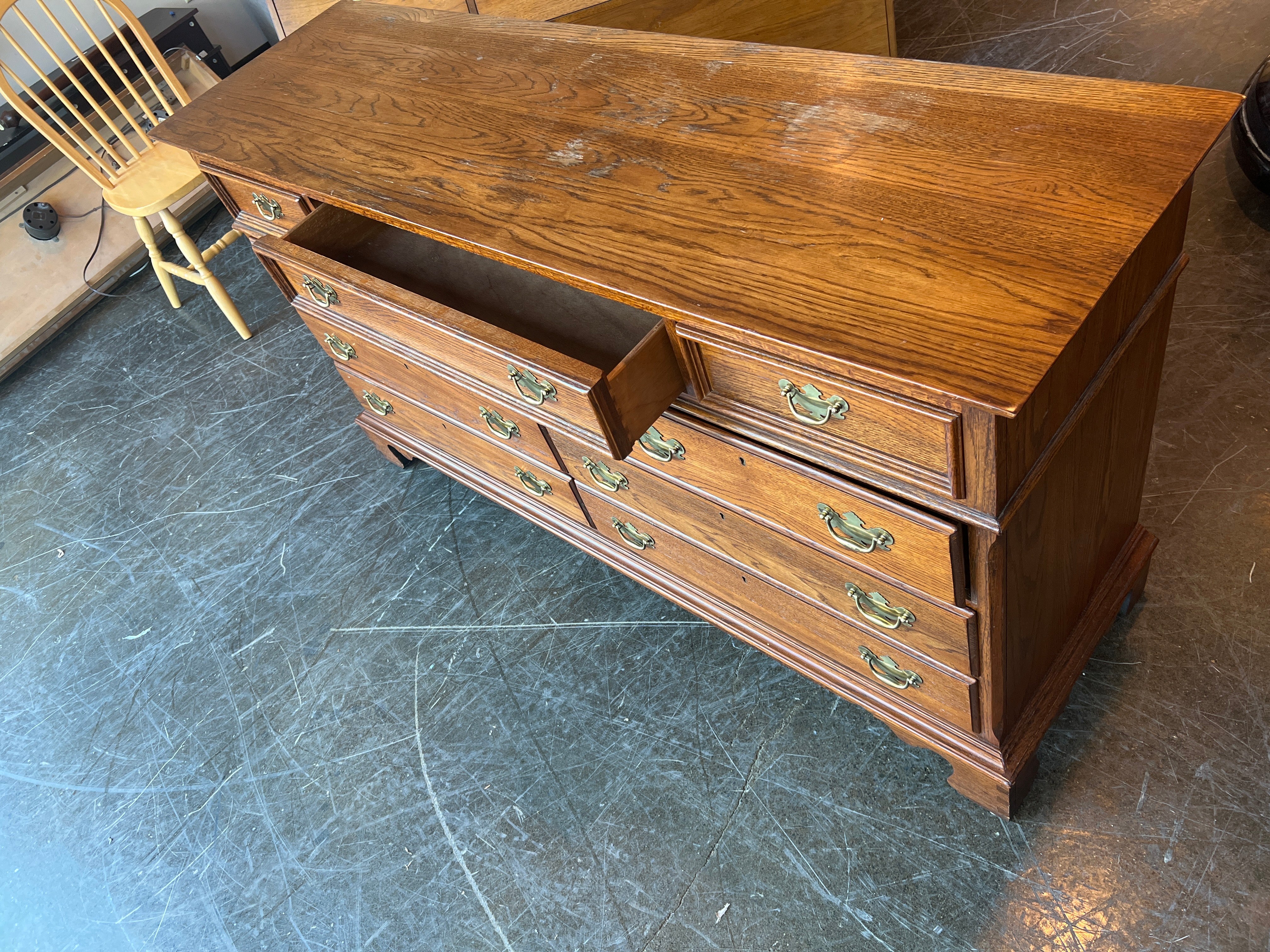 Richly-Toned Wood Dresser with Carved Center Drawer - Image 5