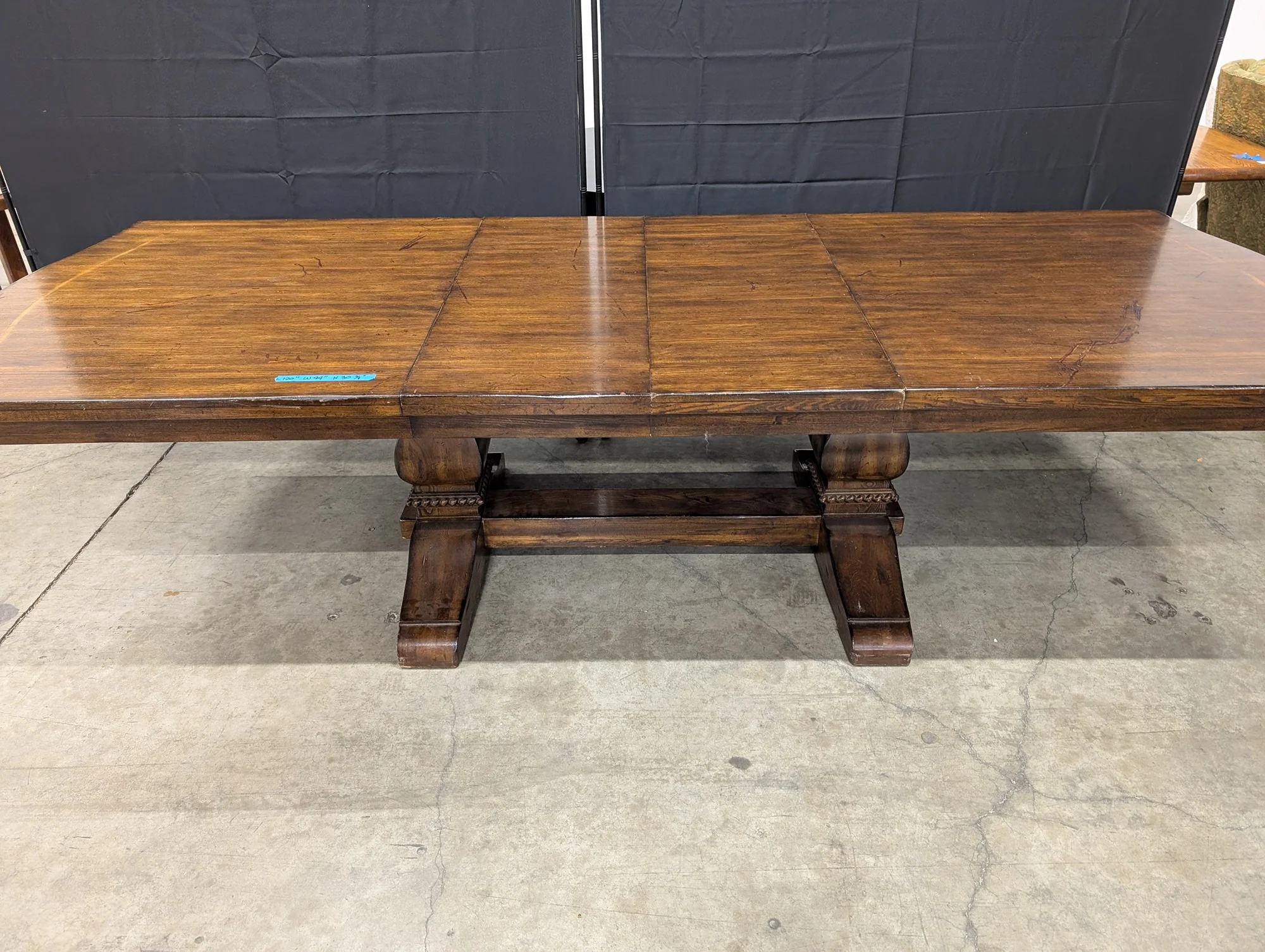 Expansive Dark Wood Pedestal Dining Table with Extension Capability