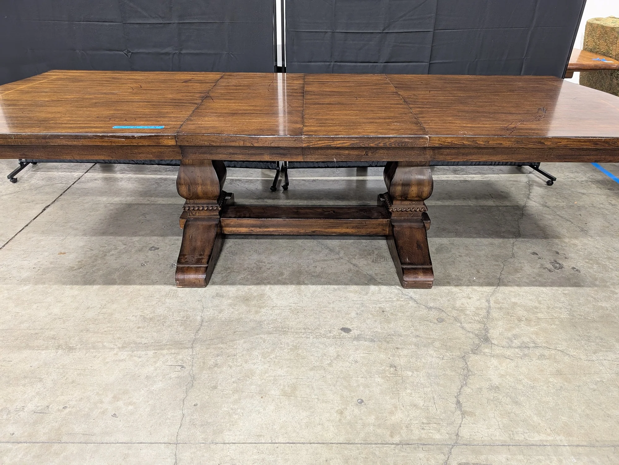 Expansive Dark Wood Pedestal Dining Table with Extension Capability - Image 3