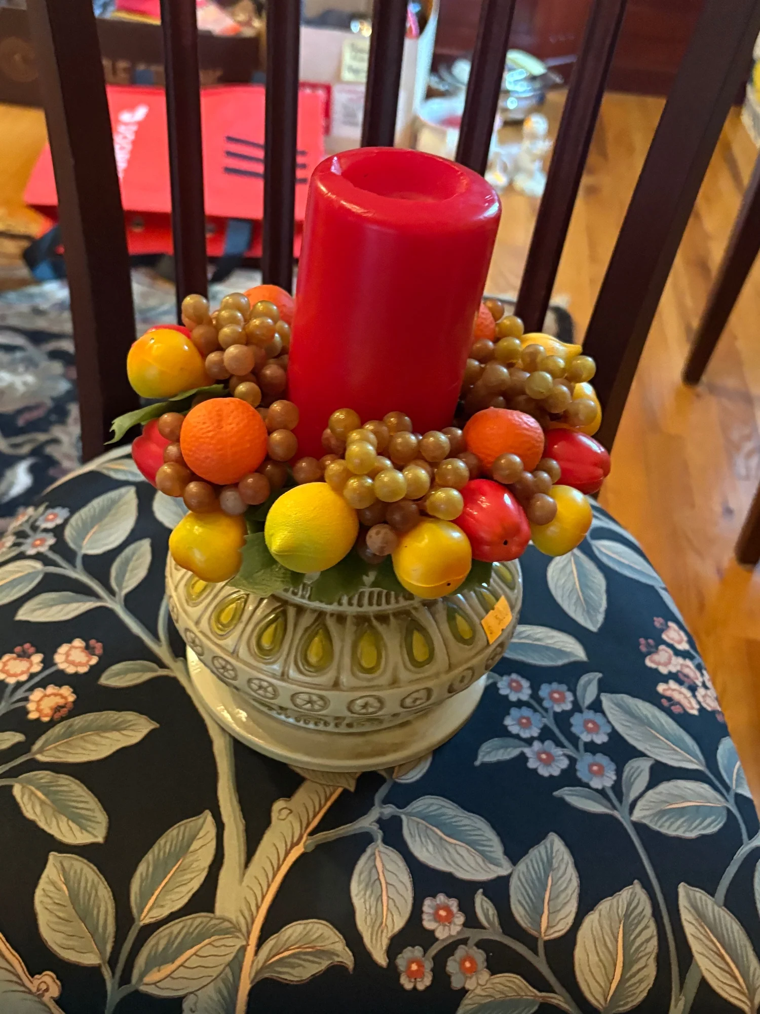 Vibrant Faux Fruit and Red Candle Centerpiece