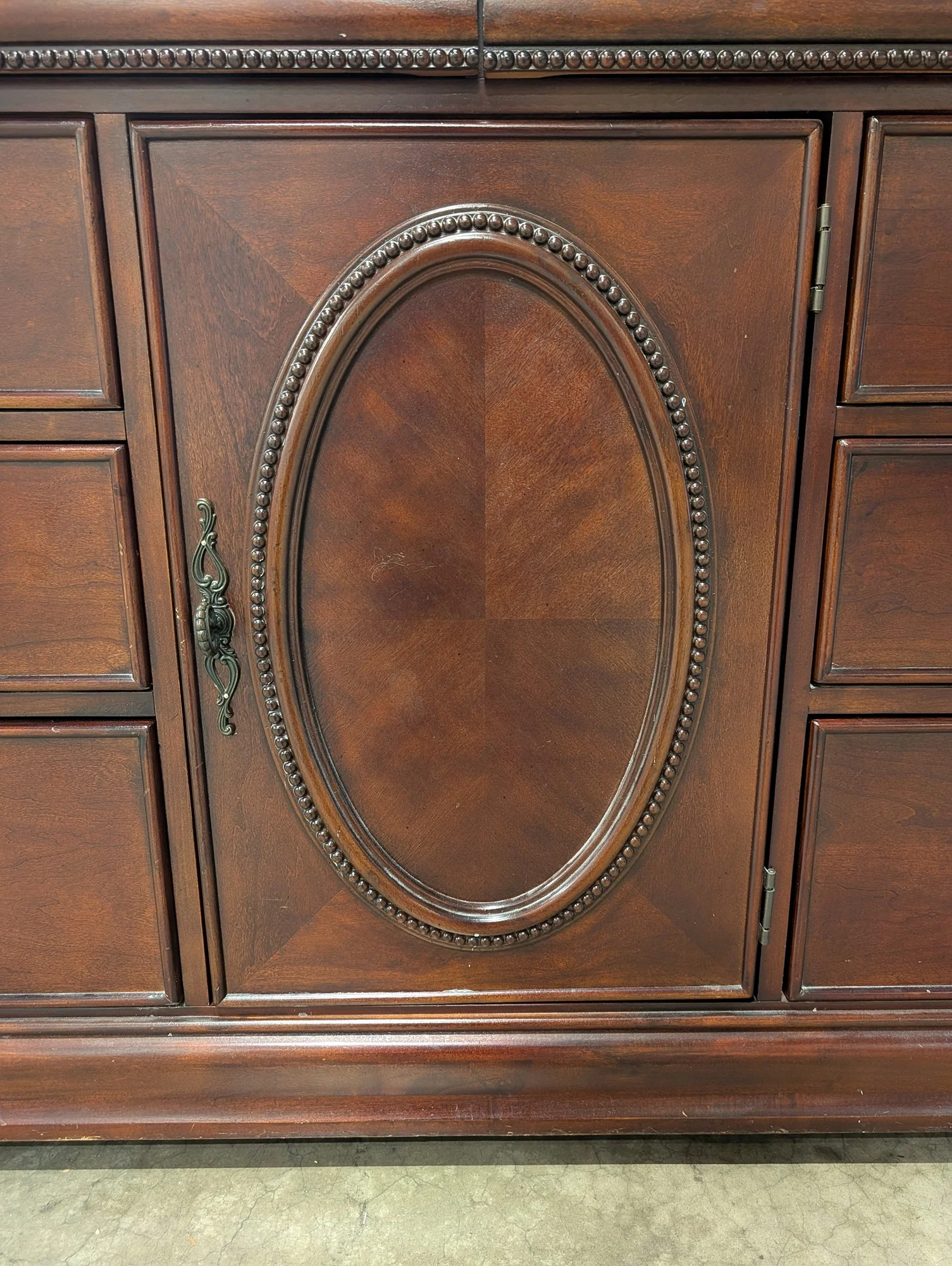 Traditional Dark Wood Dresser with Ornate Hardware - Image 4