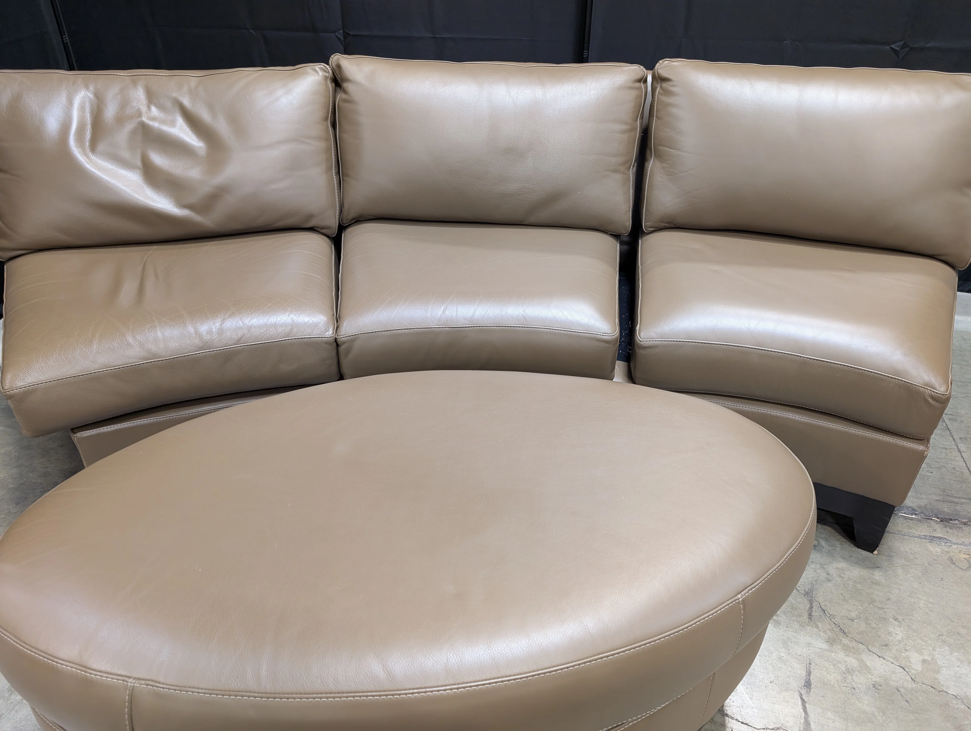 Contemporary Brown Leather Curved Sectional Sofa with Matching Round Ottoman - Image 3