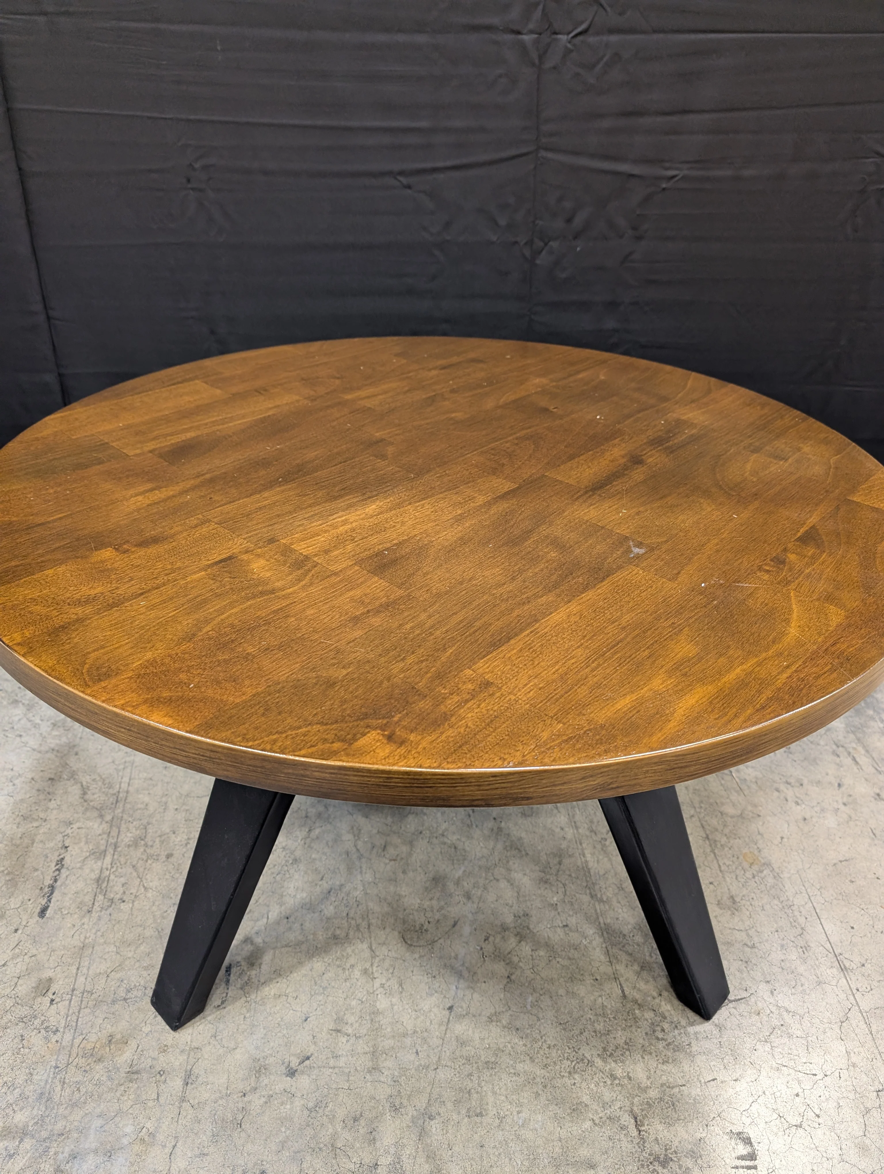 Round Dark Wood Coffee Table with Tapered Legs - Image 2