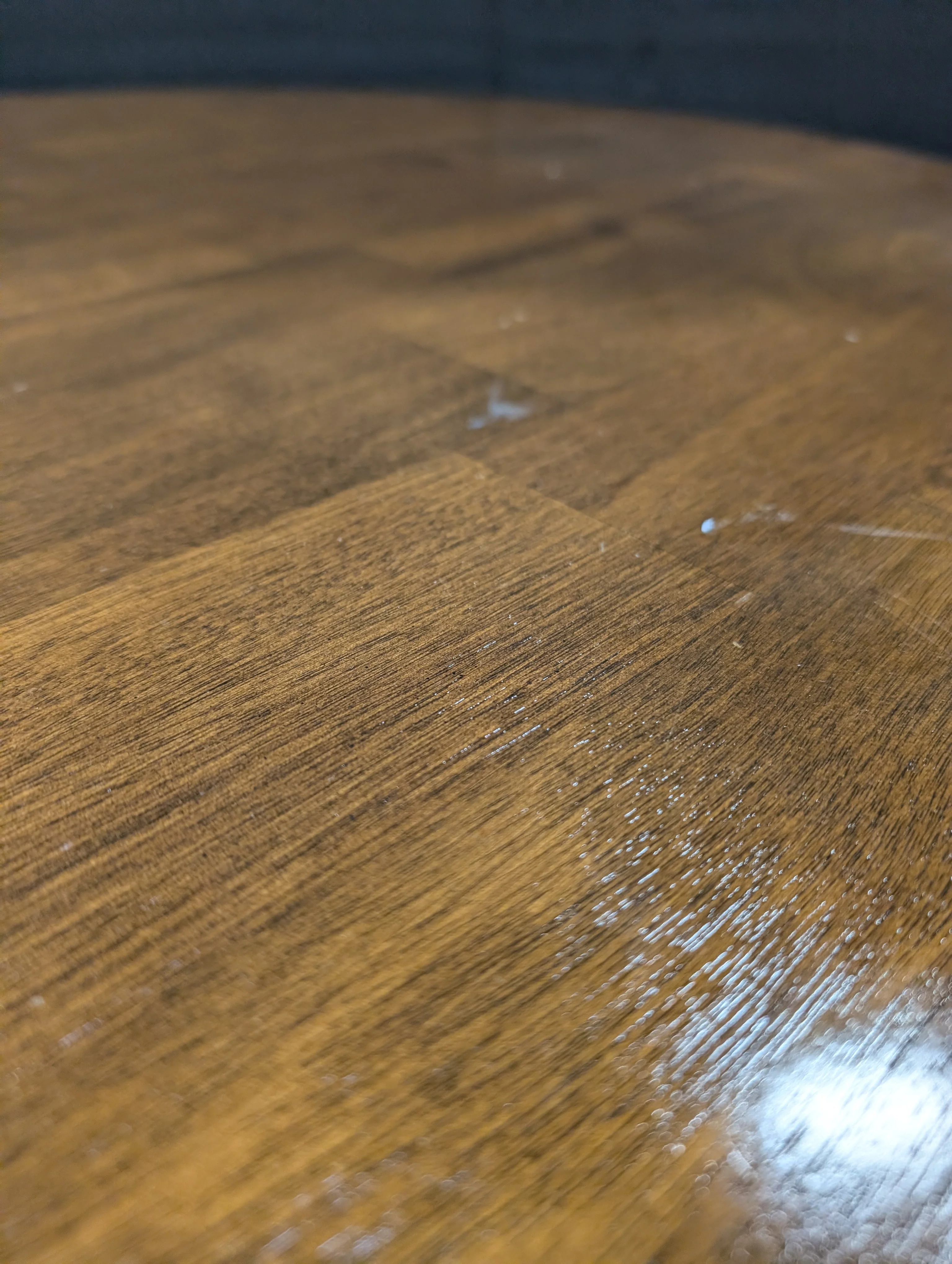 Round Dark Wood Coffee Table with Tapered Legs - Image 3