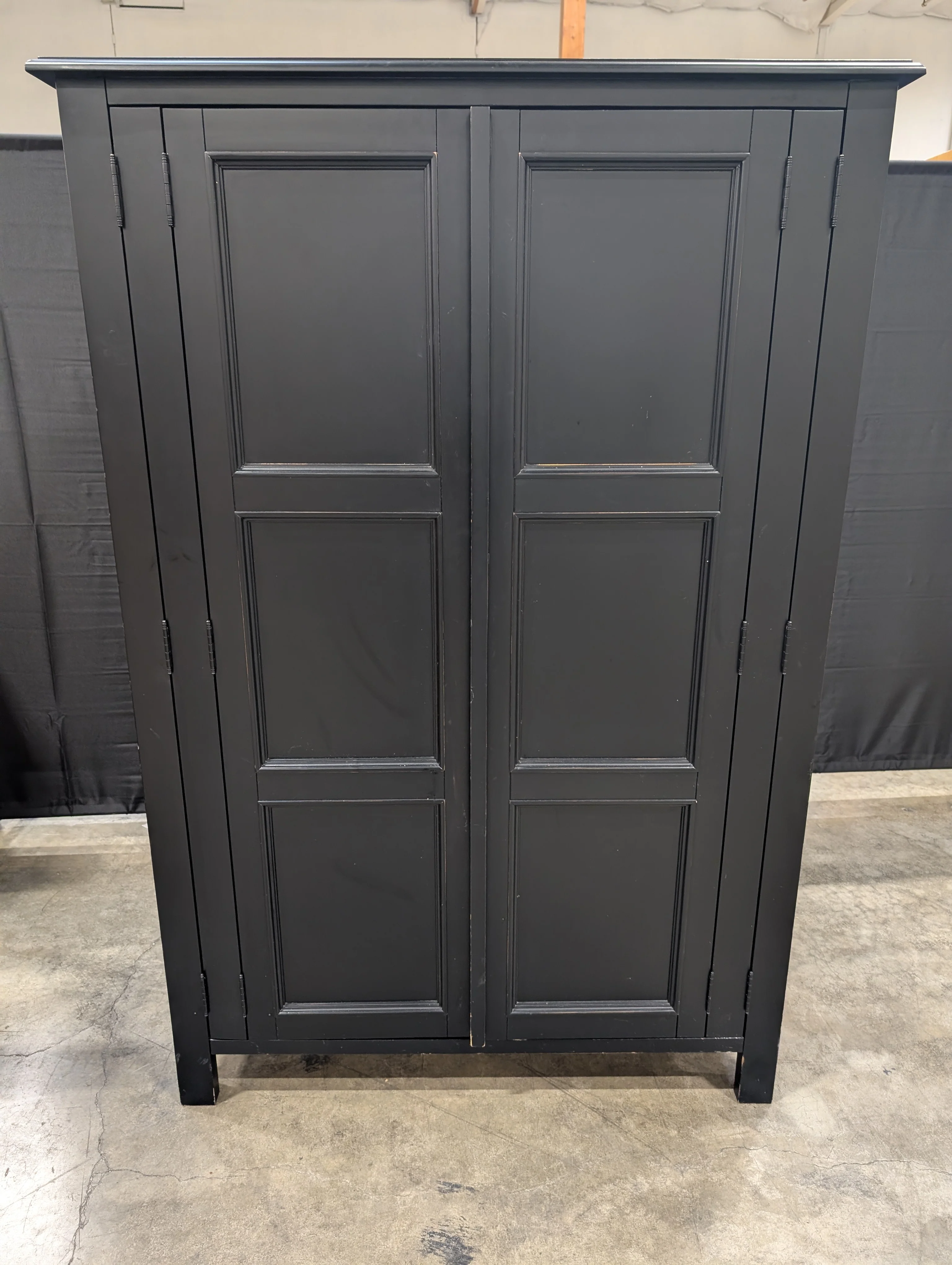 Versatile Black Wood Storage Armoire with Paneled Doors - Image 2