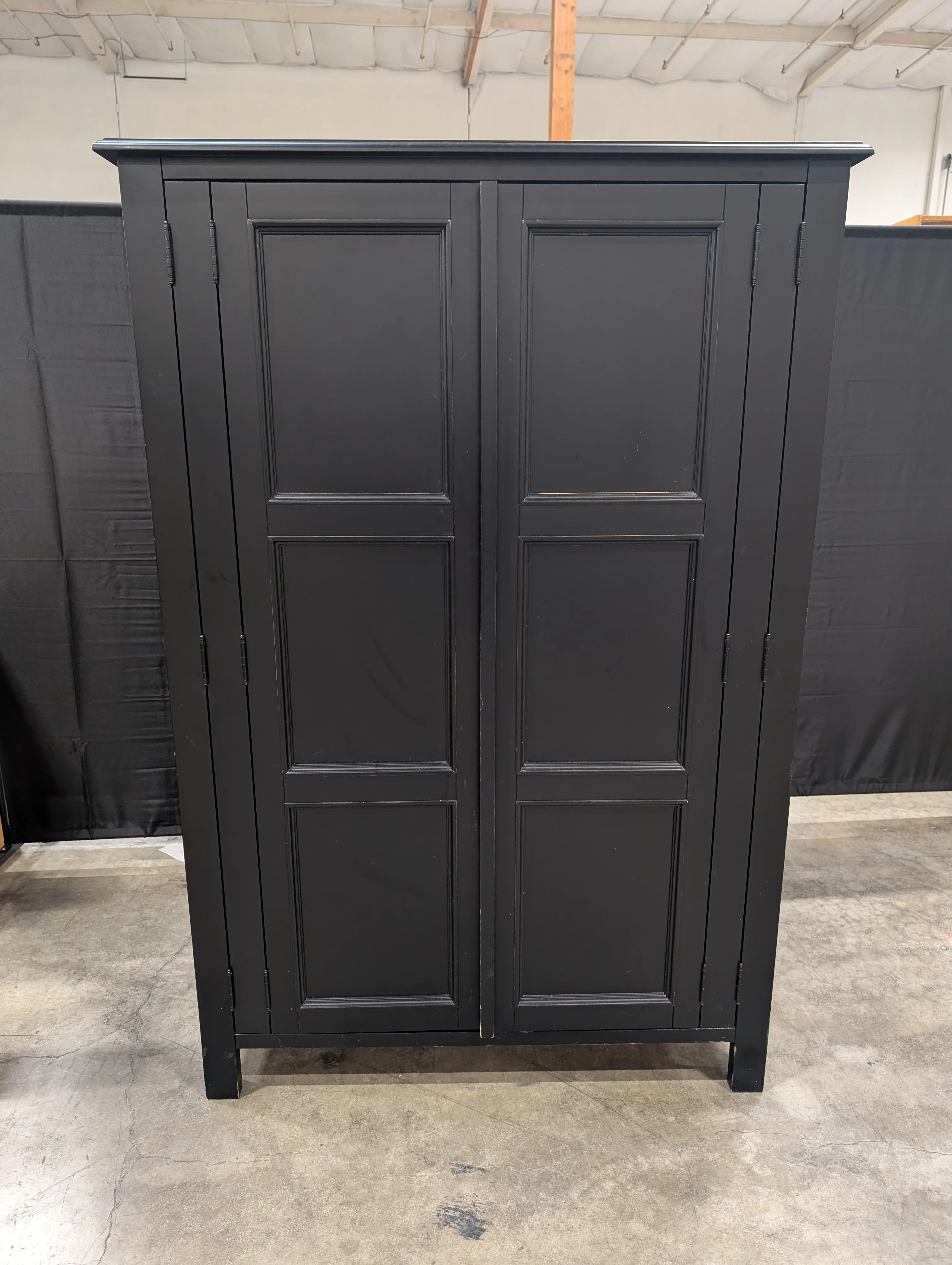 Versatile Black Wood Storage Armoire with Paneled Doors - Image 3