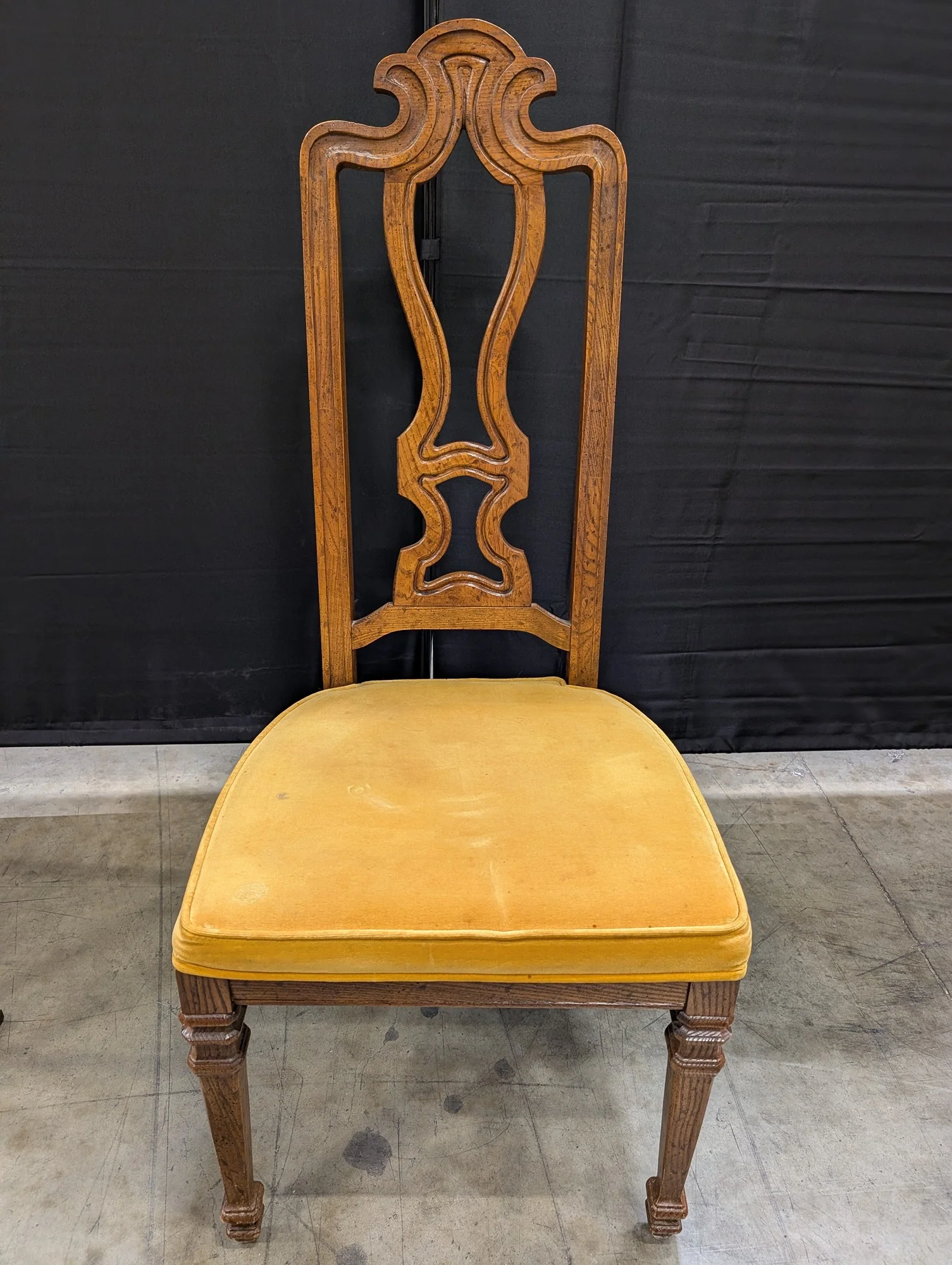 Ornate Carved Wood Accent Chair with Yellow Upholstered Seat