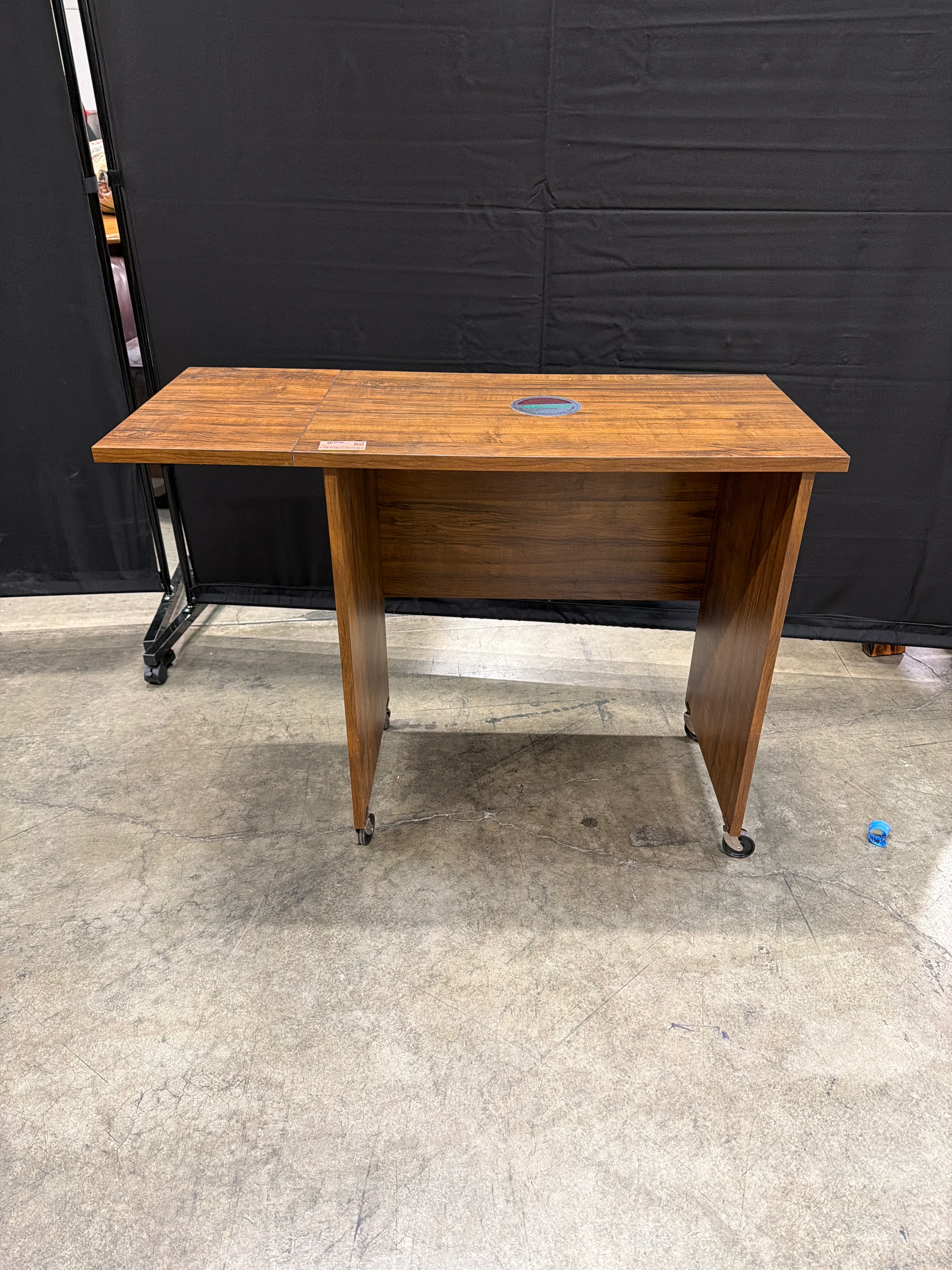 O’Sullivan Rectangular Wood Utility Table with Folding Leaf and Rolling Casters
