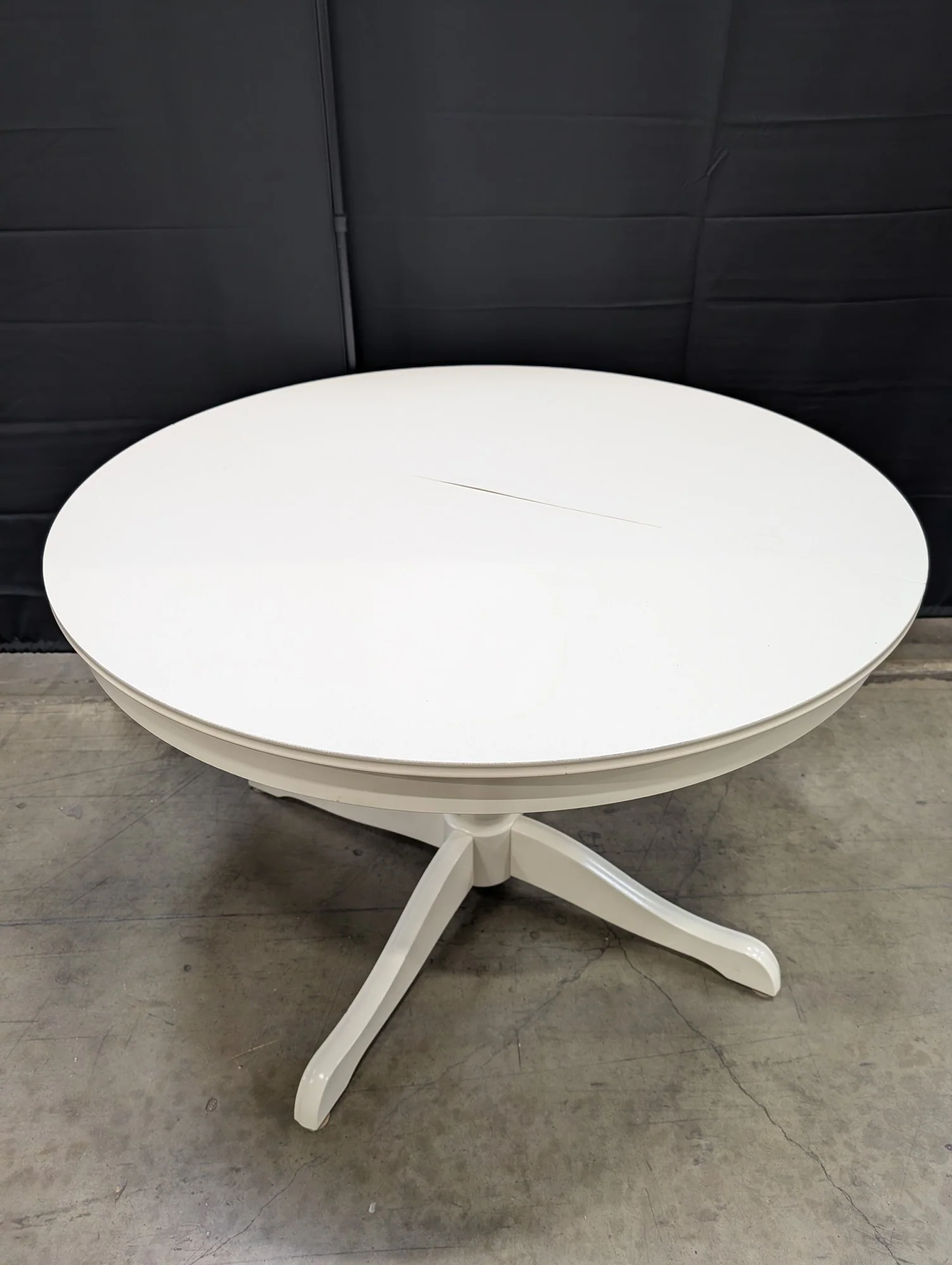 Versatile White Round Pedestal Dining Table with in-built leaf