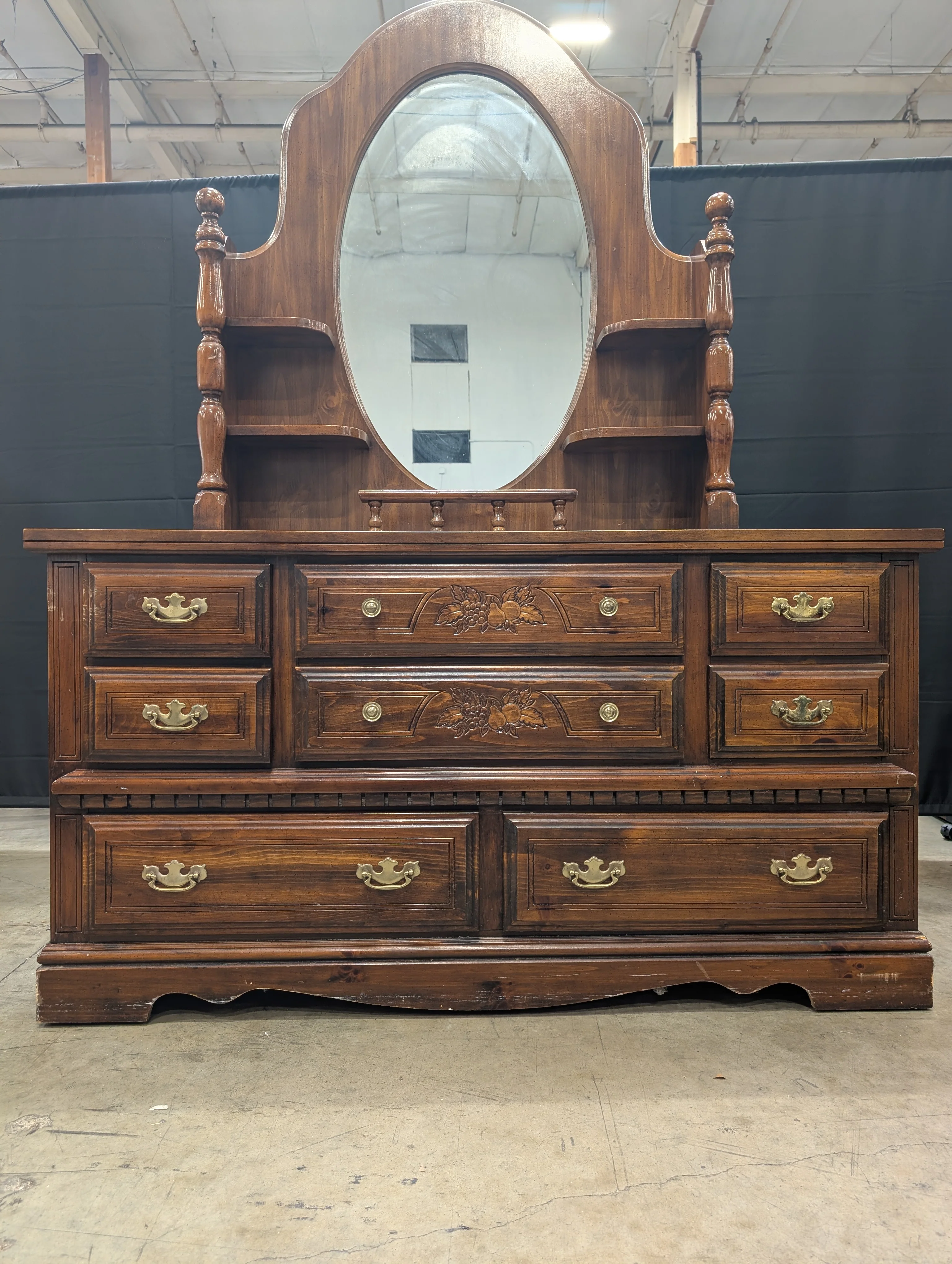 Traditional Dark Wood Dresser with Oval Mirror and Carved Accents - Image 2