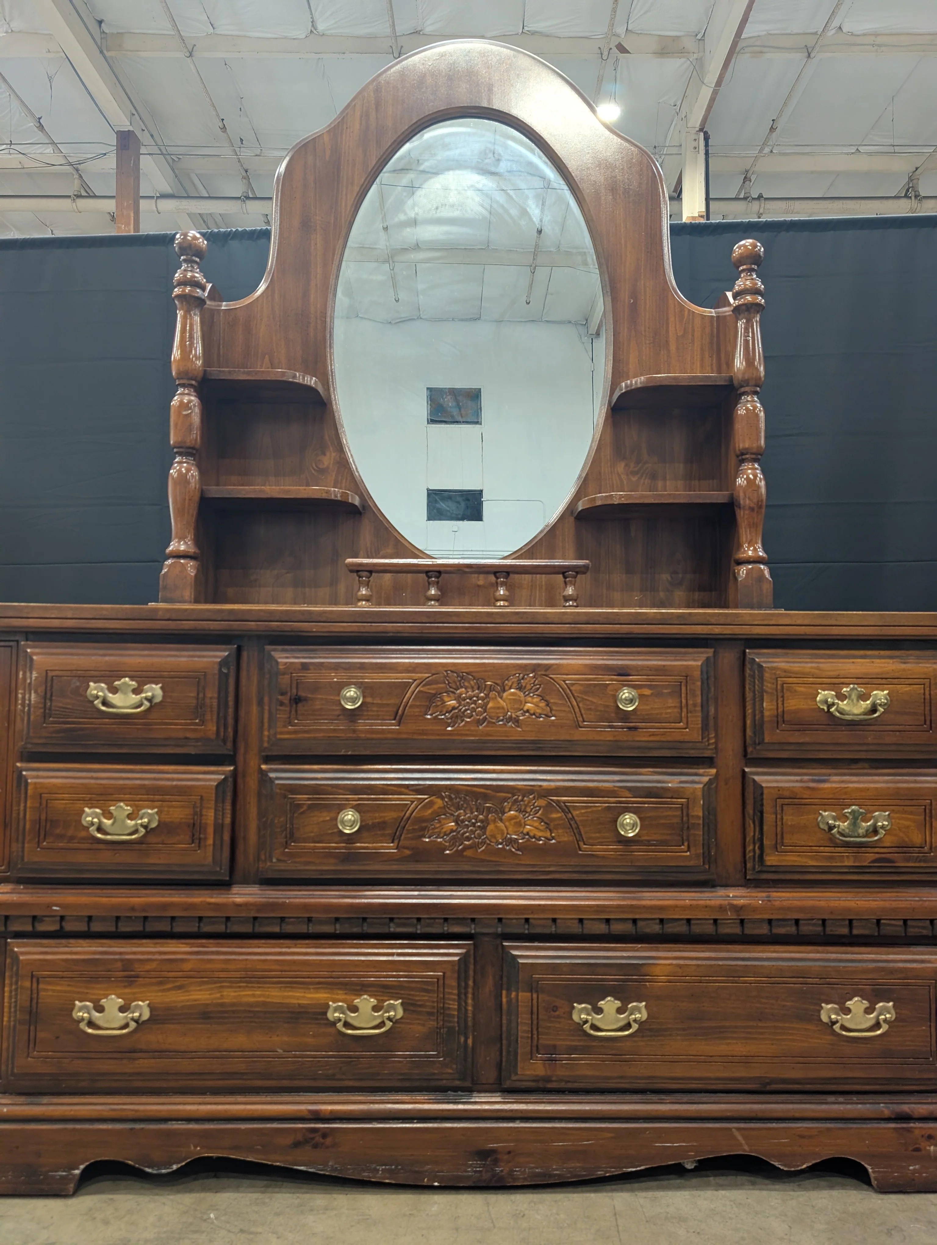 Traditional Dark Wood Dresser with Oval Mirror and Carved Accents - Image 3