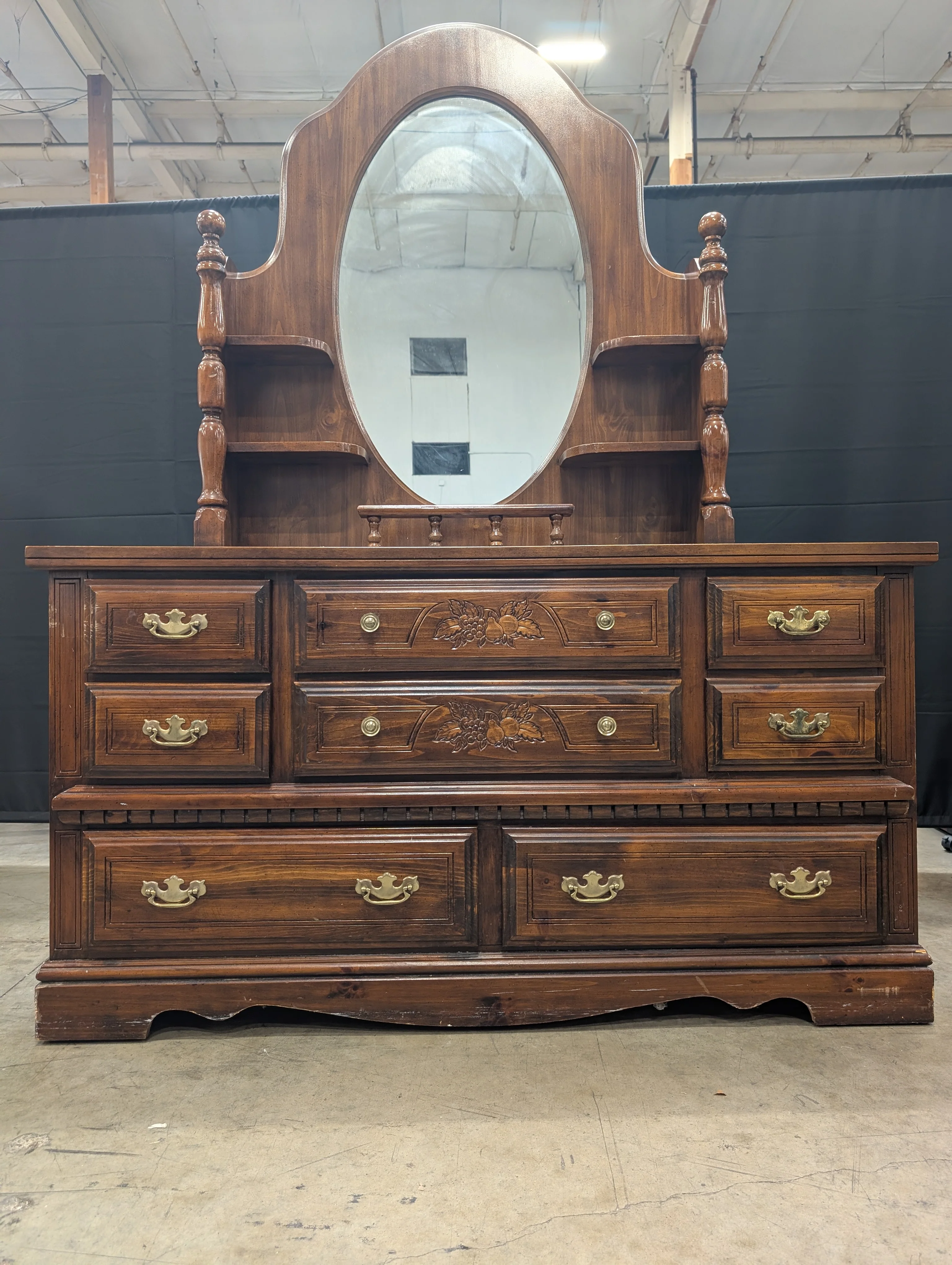 Traditional Dark Wood Dresser with Oval Mirror and Carved Accents - Image 4