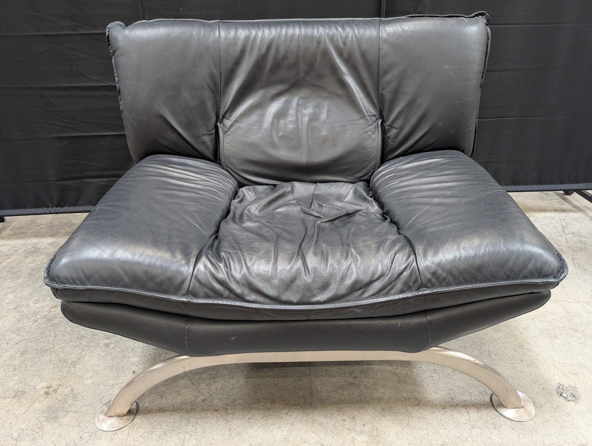 Contemporary Black Leather Lounge Chair with Arched Metal Base