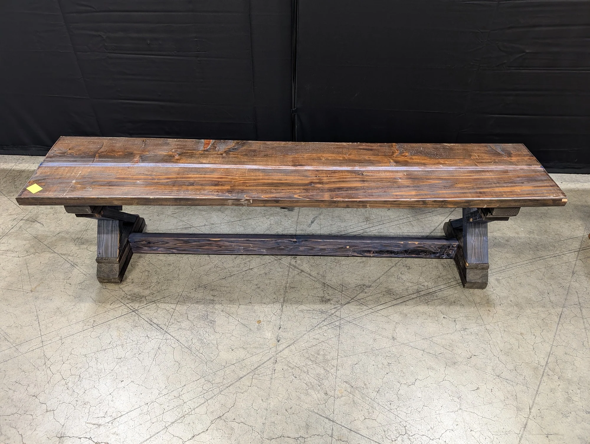 Sturdy Dark Stained Wood Trestle Bench