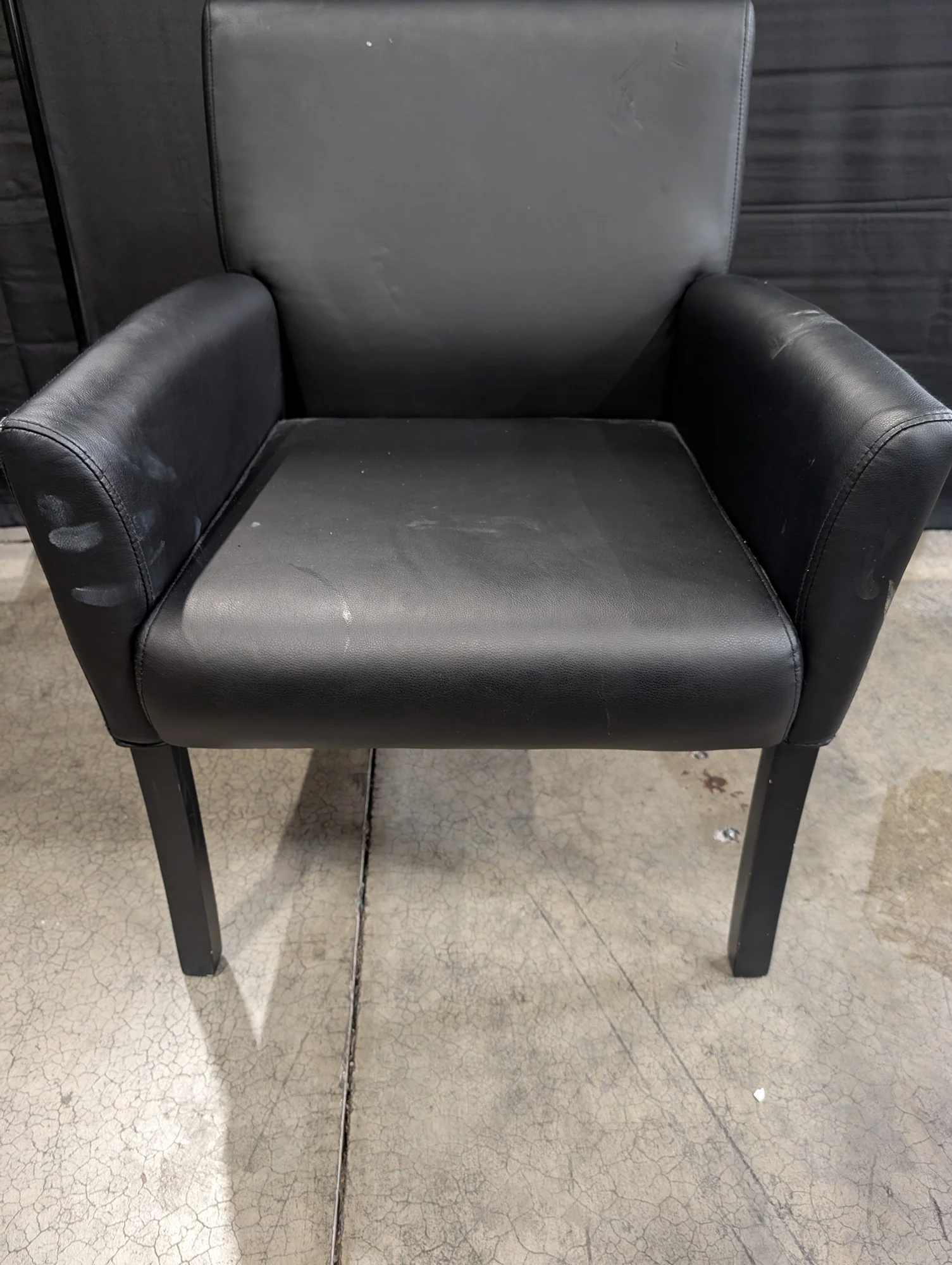 Modern Black Upholstered Armchair with Dark Legs