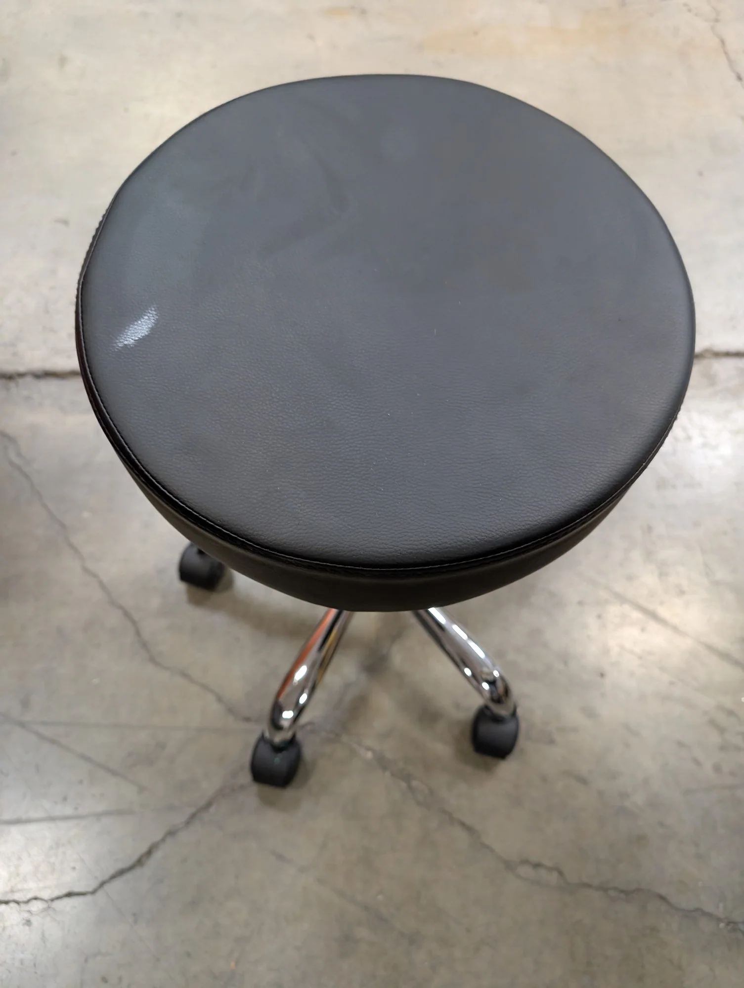 Adjustable Rolling Stool with Black Upholstered Seat
