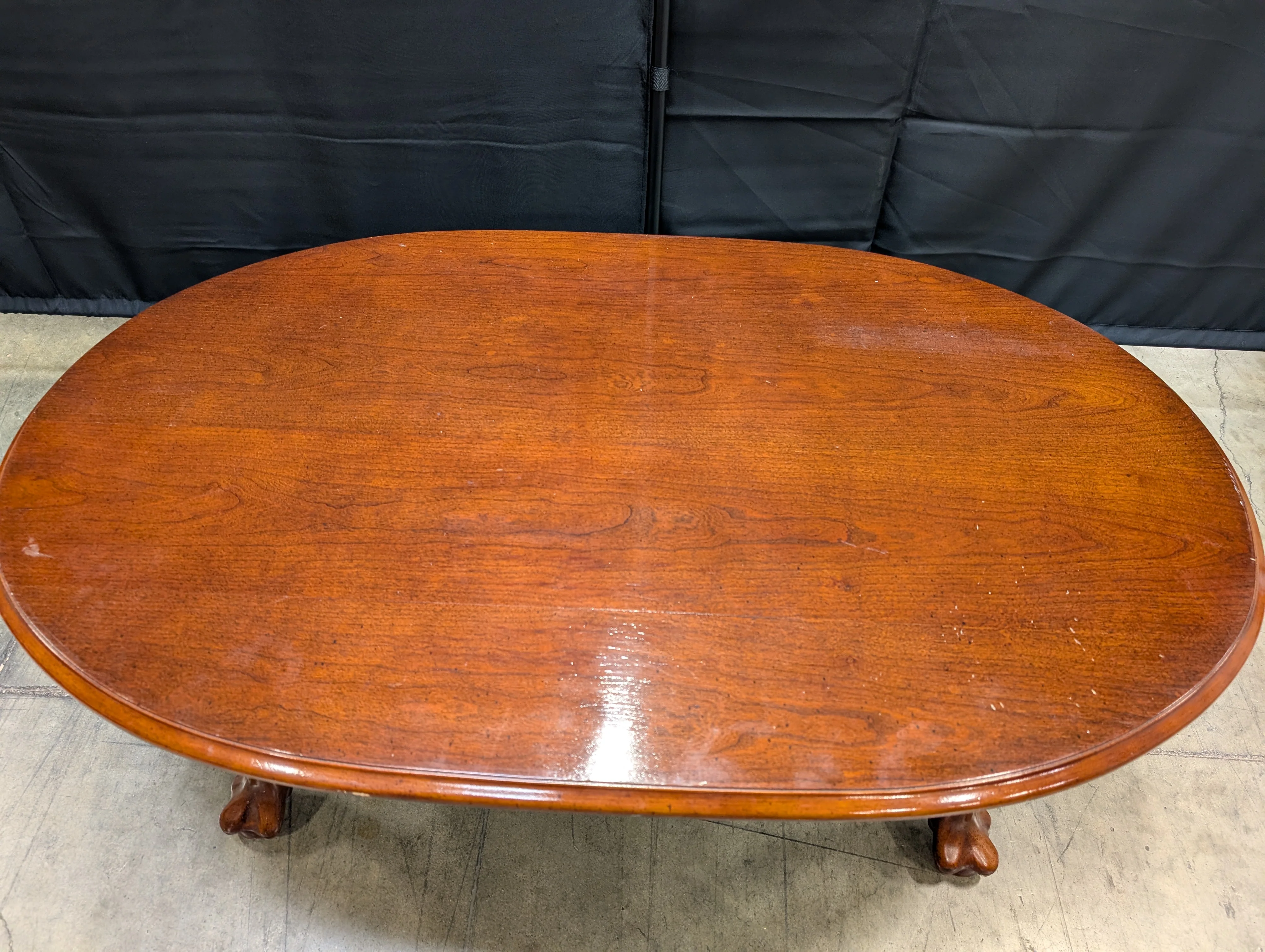 Rich Cherry Wood Oval Coffee Table with Curved Legs - Image 6