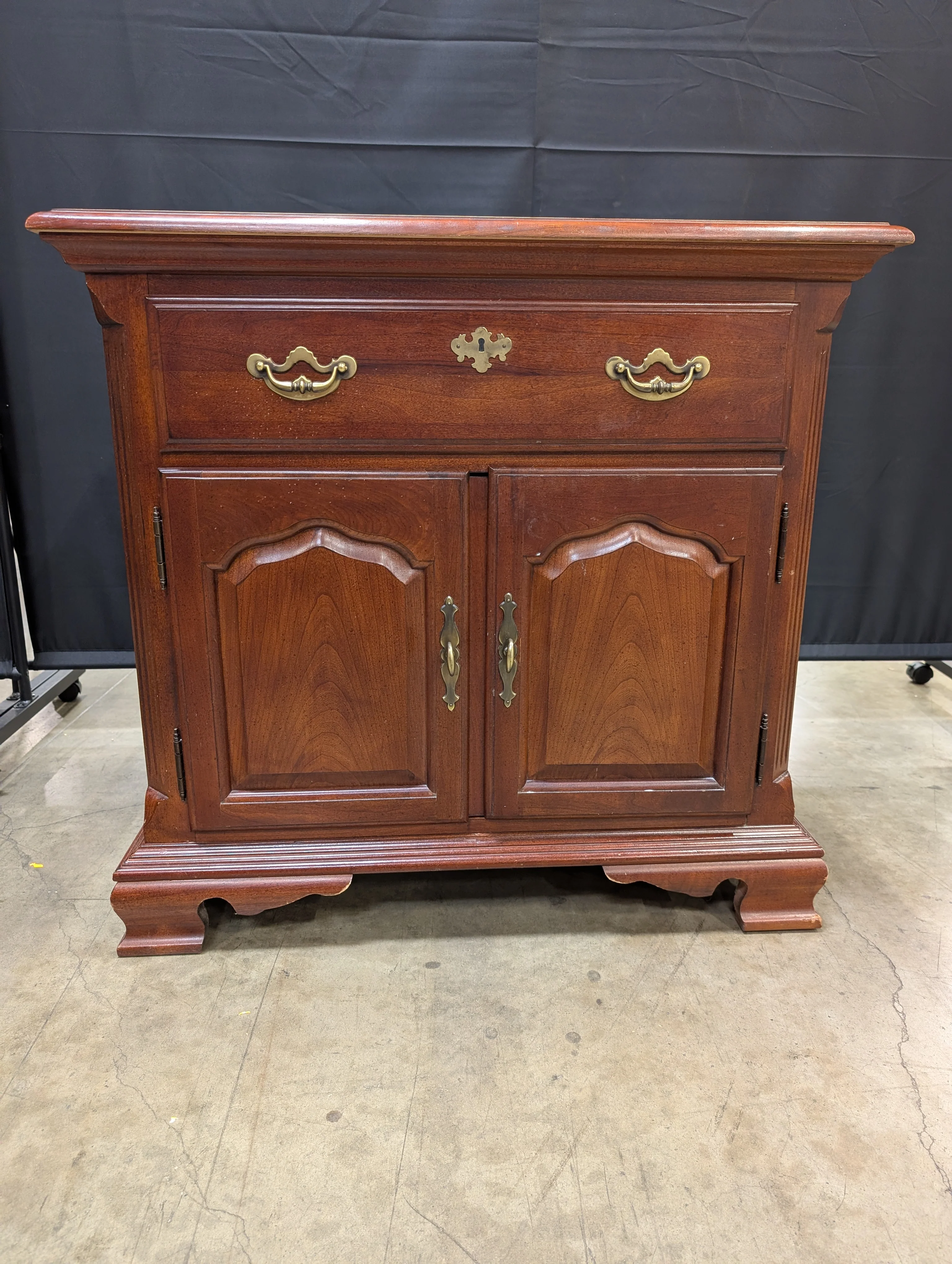 Traditional Reddish Brown Wood Accent Cabinet with Ornate Hardware