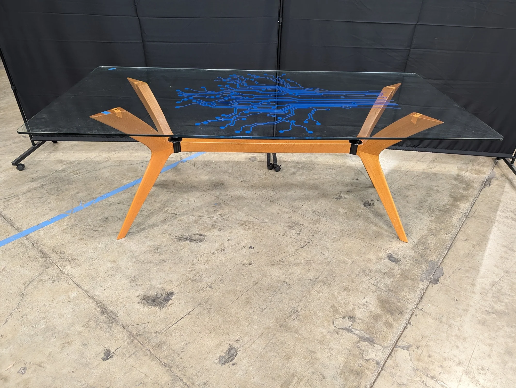 Modern Tech-Inspired Glass Top Dining Table with Splayed Wood Base - Image 2