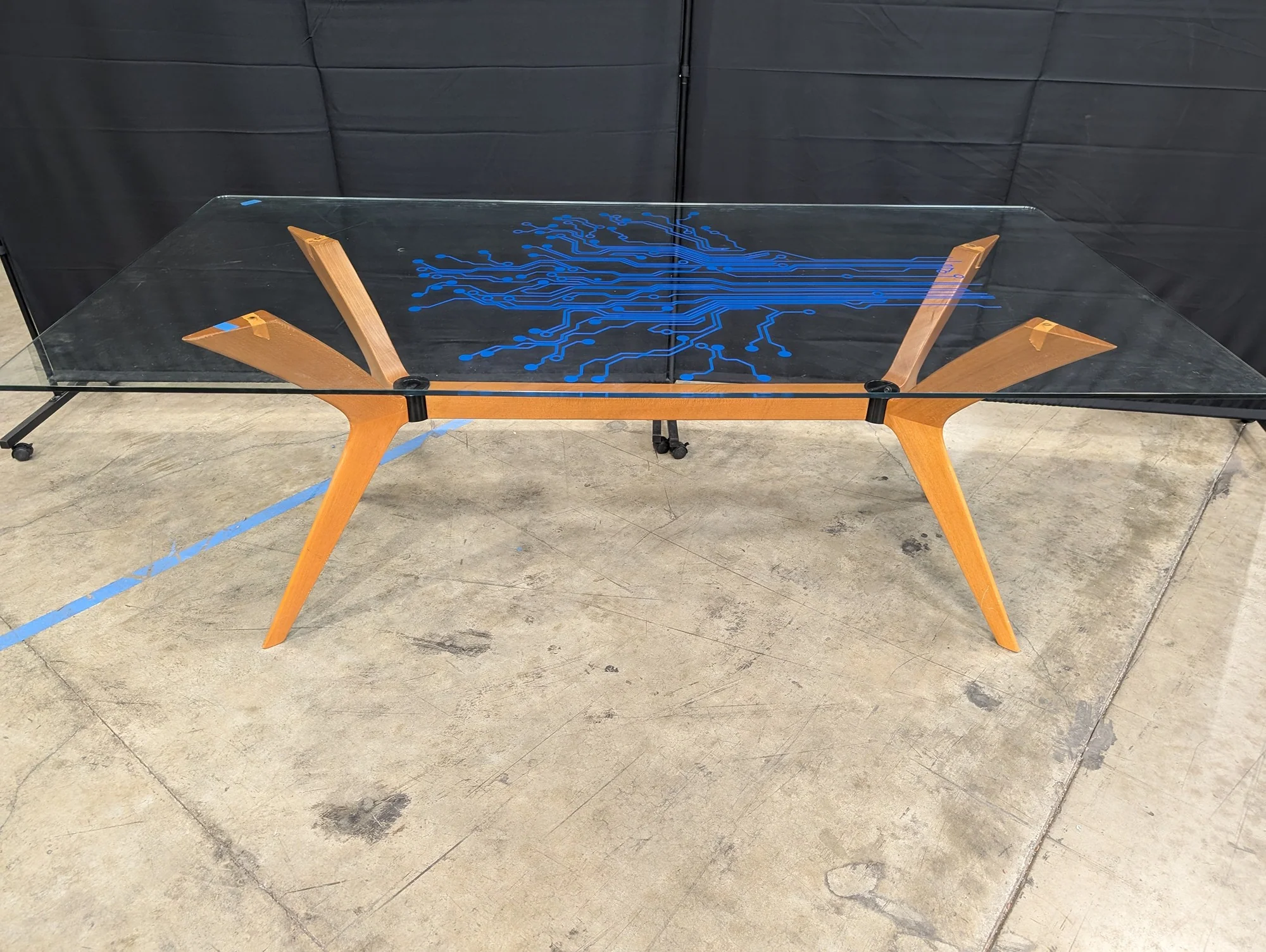 Modern Tech-Inspired Glass Top Dining Table with Splayed Wood Base - Image 3