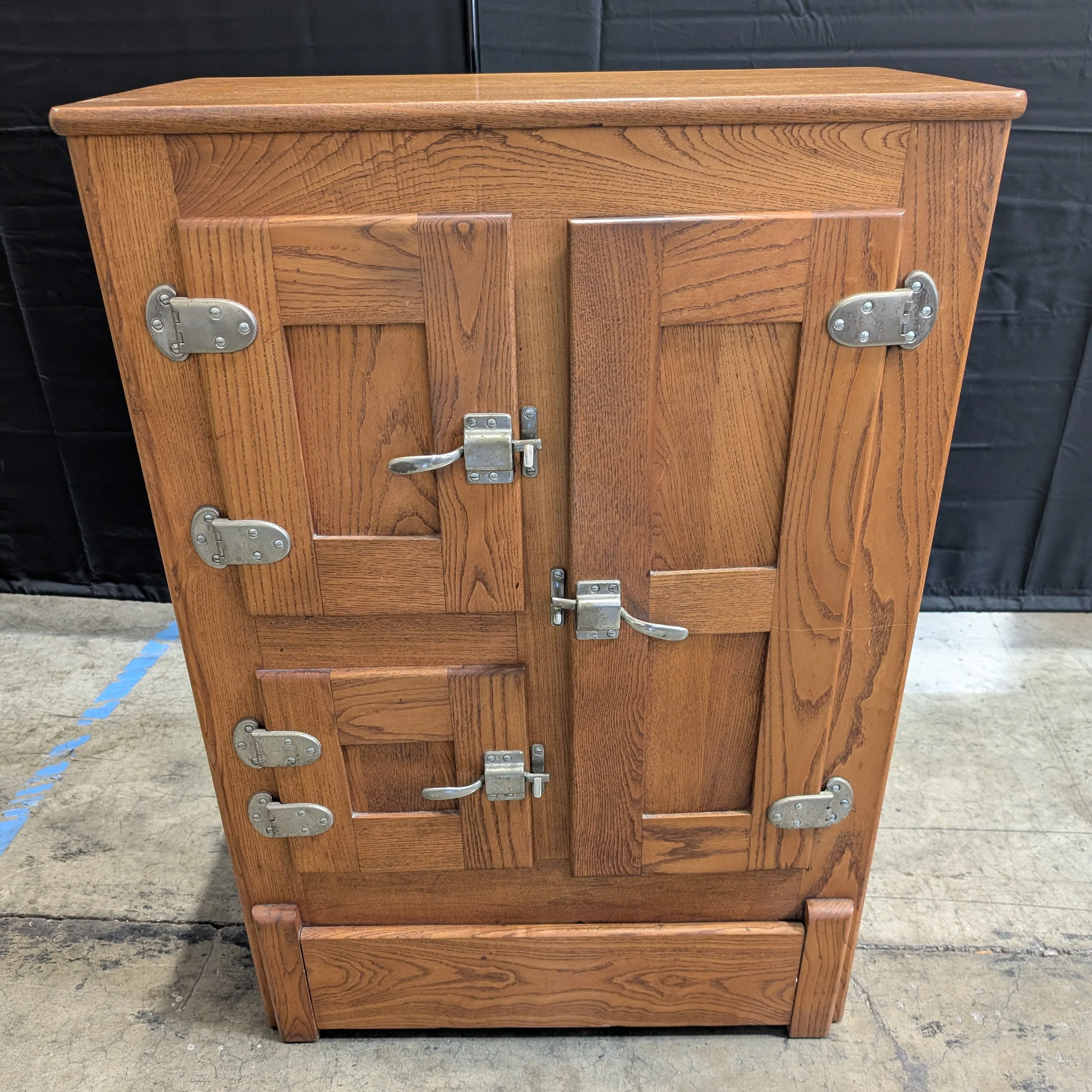 Rustic Wood Storage Cabinet with Paneled Doors and Metal Latches