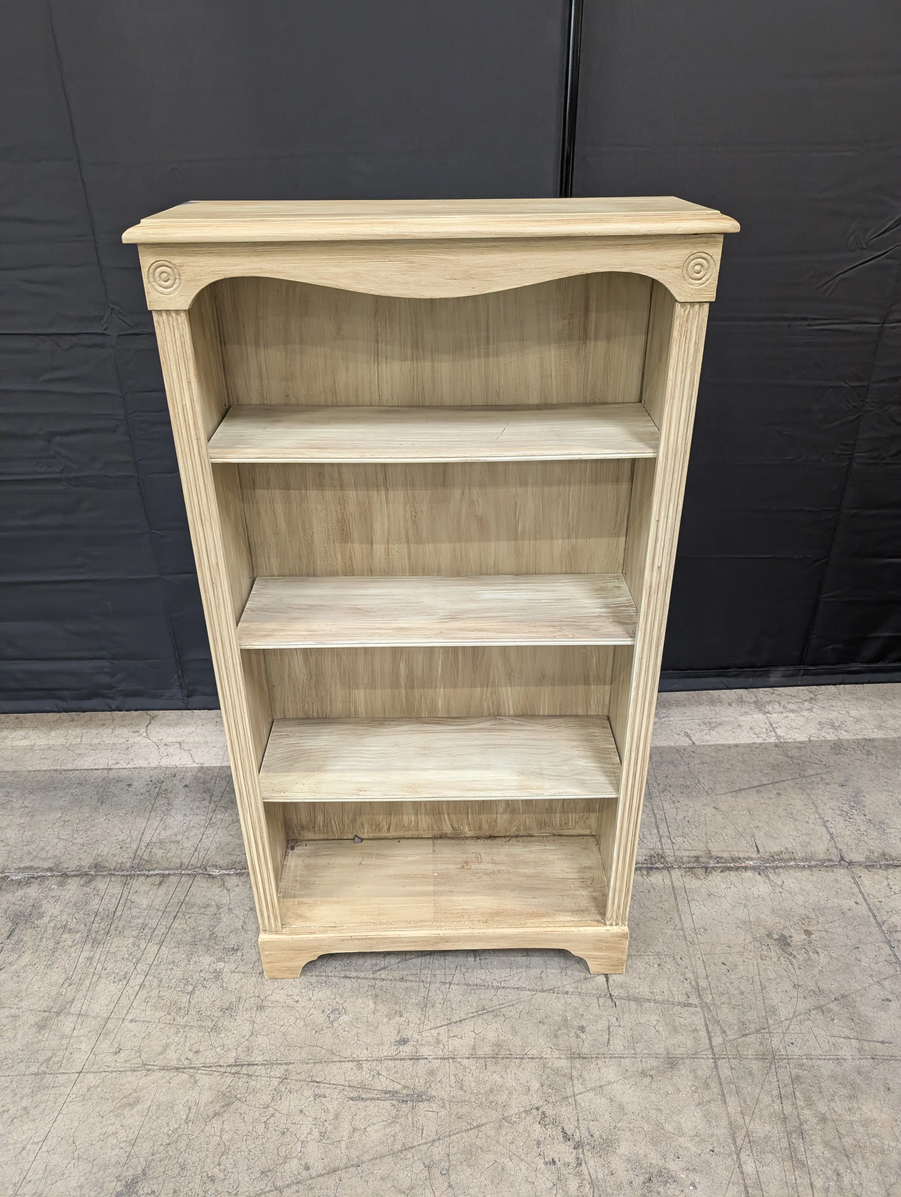 Light Wood Tone Four-Shelf Bookcase with Arched Detail