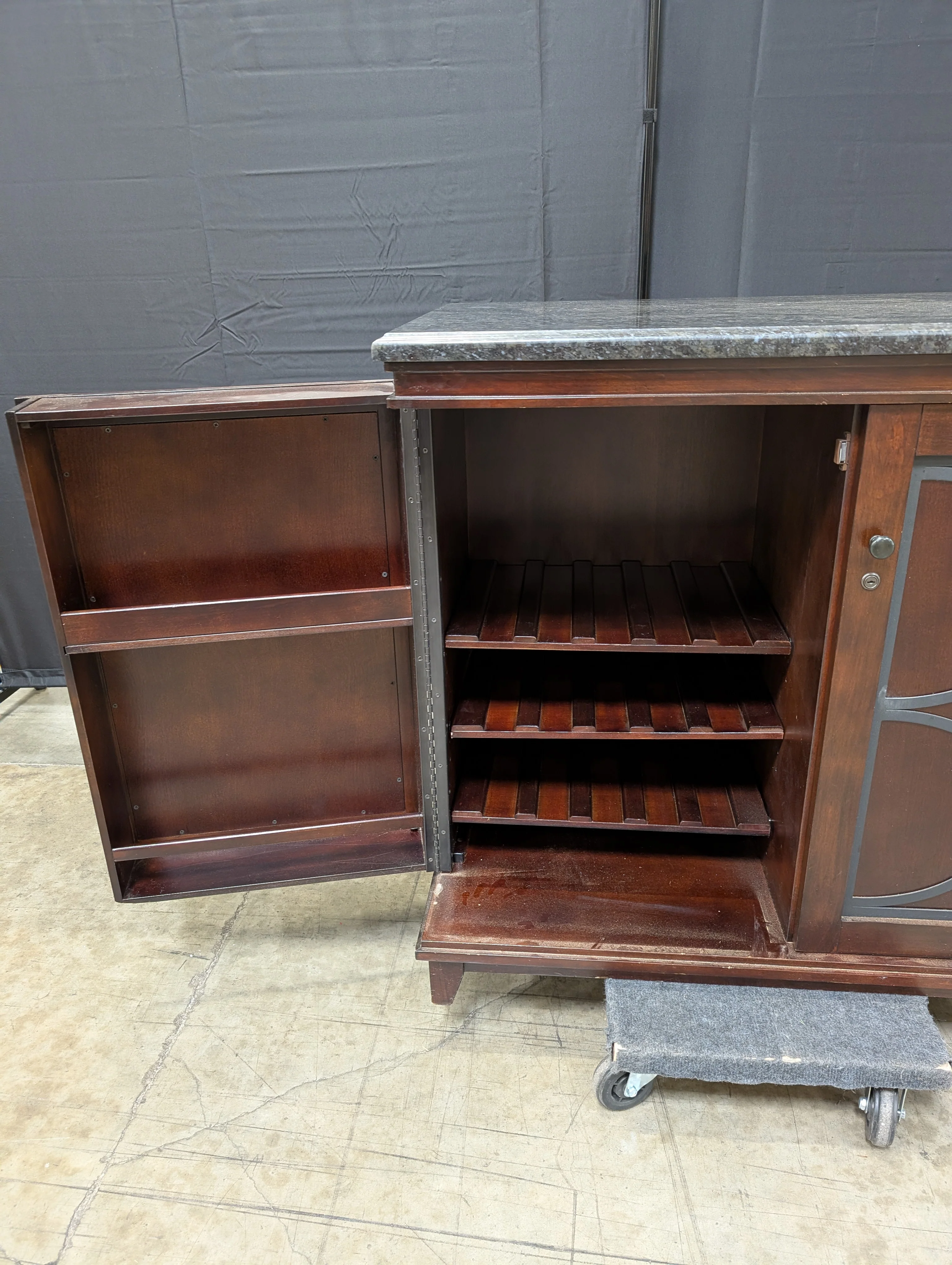 Dark Wood Storage Cabinet with Granite Top and Decorative Doors - Image 3