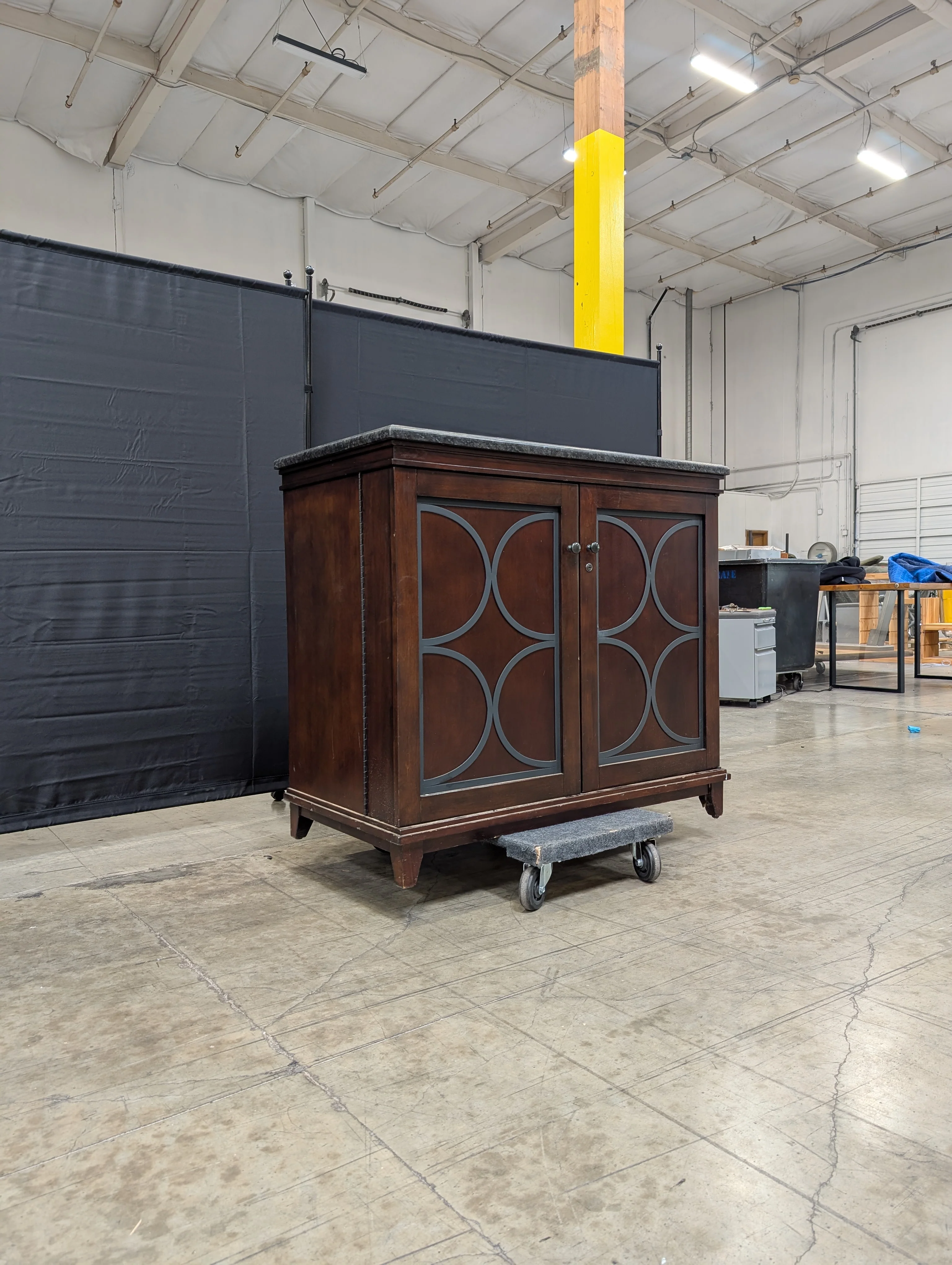 Dark Wood Storage Cabinet with Granite Top and Decorative Doors - Image 5