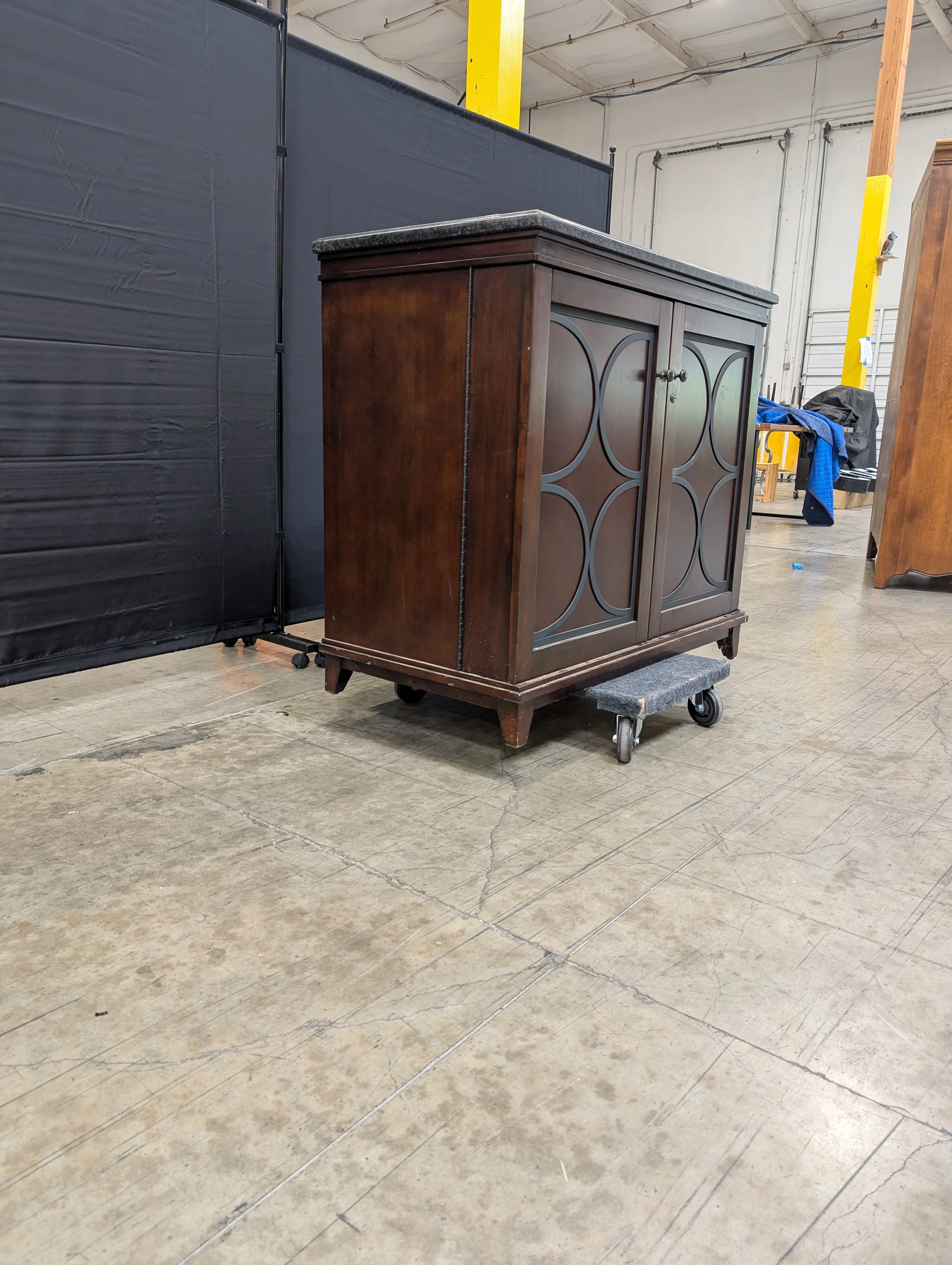 Dark Wood Storage Cabinet with Granite Top and Decorative Doors - Image 6