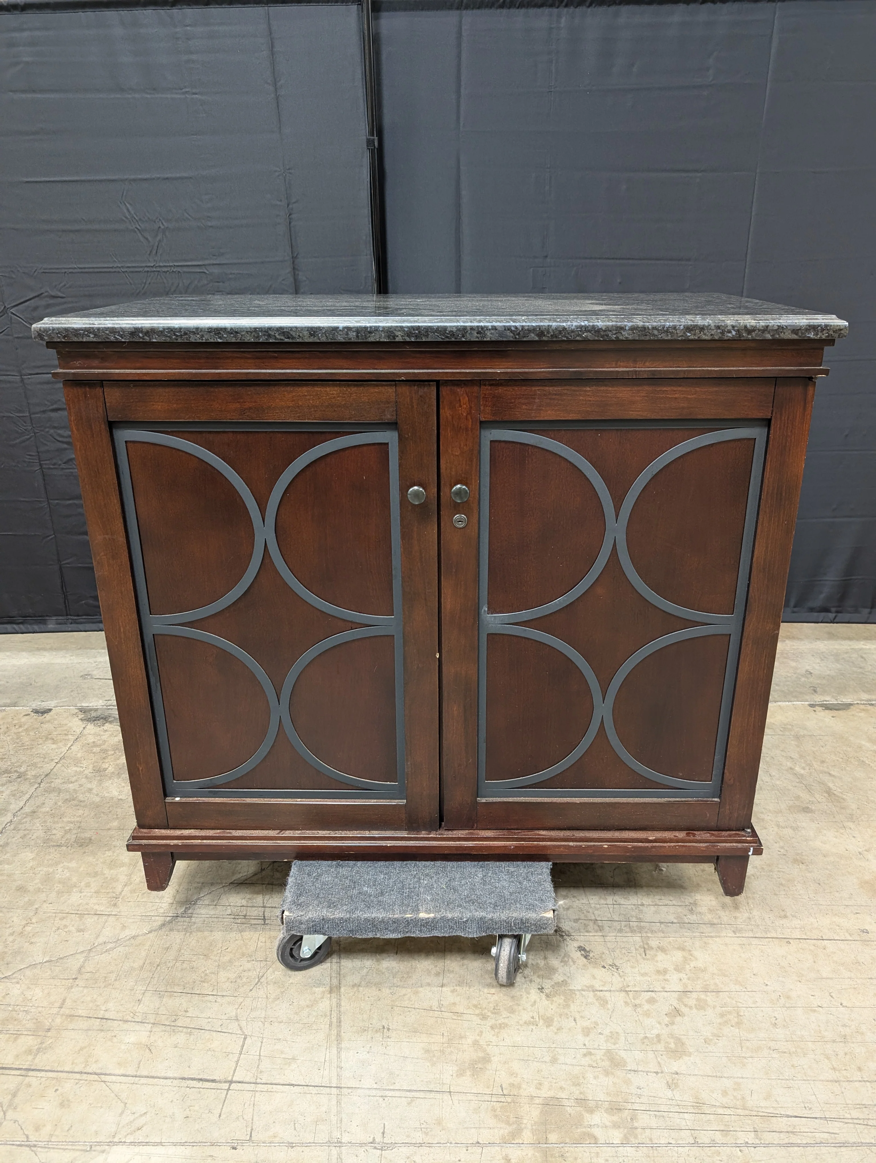 Dark Wood Storage Cabinet with Granite Top and Decorative Doors - Image 8