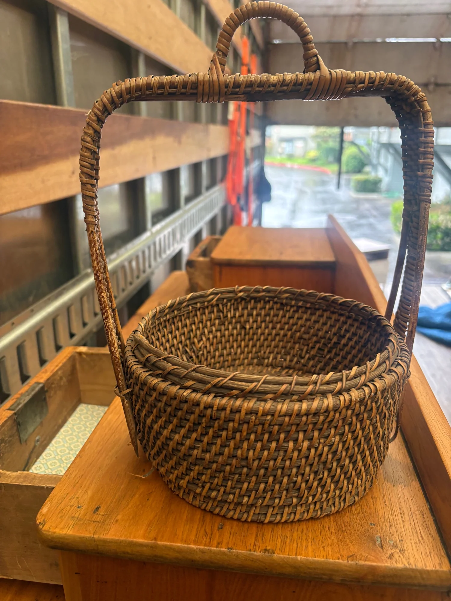 Rustic Woven Rattan Round Storage Basket with Arched Handle - Image 2