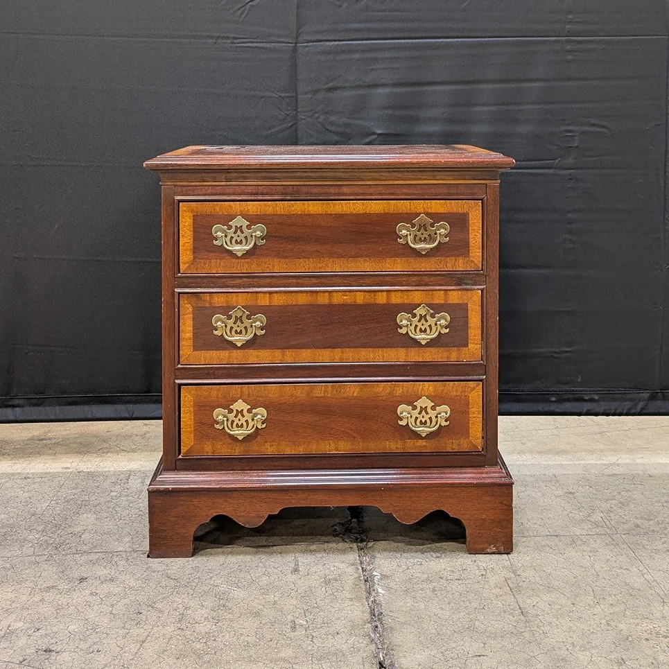 Traditional Dark Wood Three-Drawer Chest with Ornate Brass Pulls