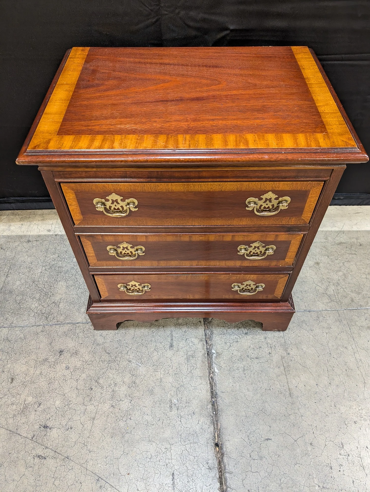 Traditional Dark Wood Three-Drawer Chest with Ornate Brass Pulls - Image 4