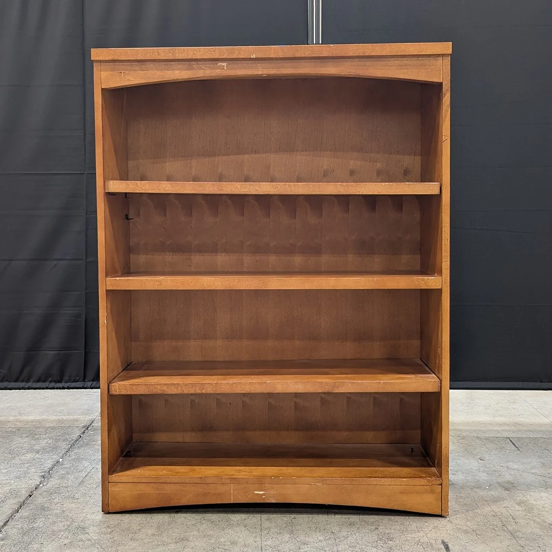 Compact Stained Wood Bookcase with Arched Top